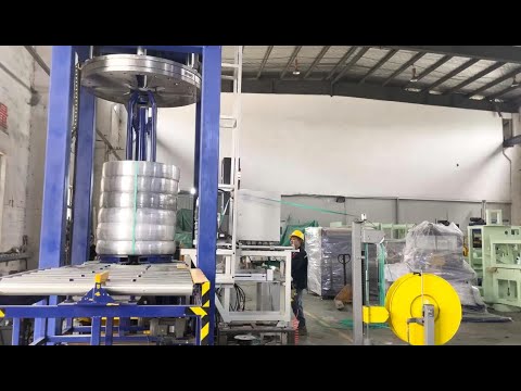 automatic steel wire compacting and strapping machine with carrier take off station