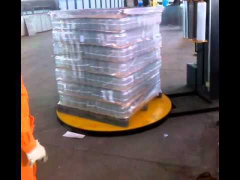 Automatic pallet wrapping machine with PLC control